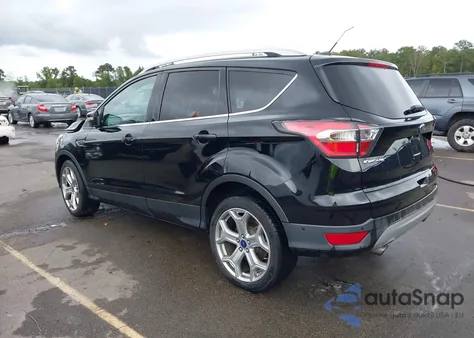 2017 Ford Escape Titanium z USA, uszkodzony, nr VIN 1FMCU0J95HUA75324